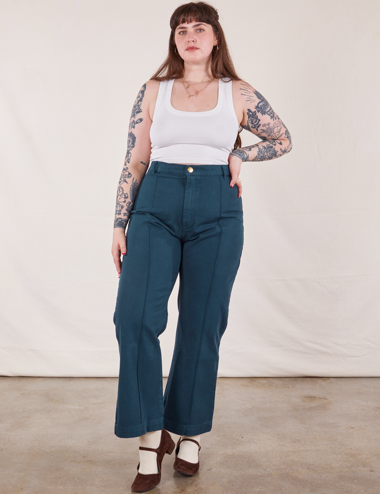 Sydney is 5&#39;9&quot; and wearing L Western Pants in Lagoon paired with vintage tee off-white Cropped Tank