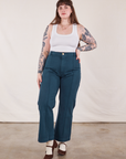 Sydney is 5'9" and wearing L Western Pants in Lagoon paired with vintage tee off-white Cropped Tank
