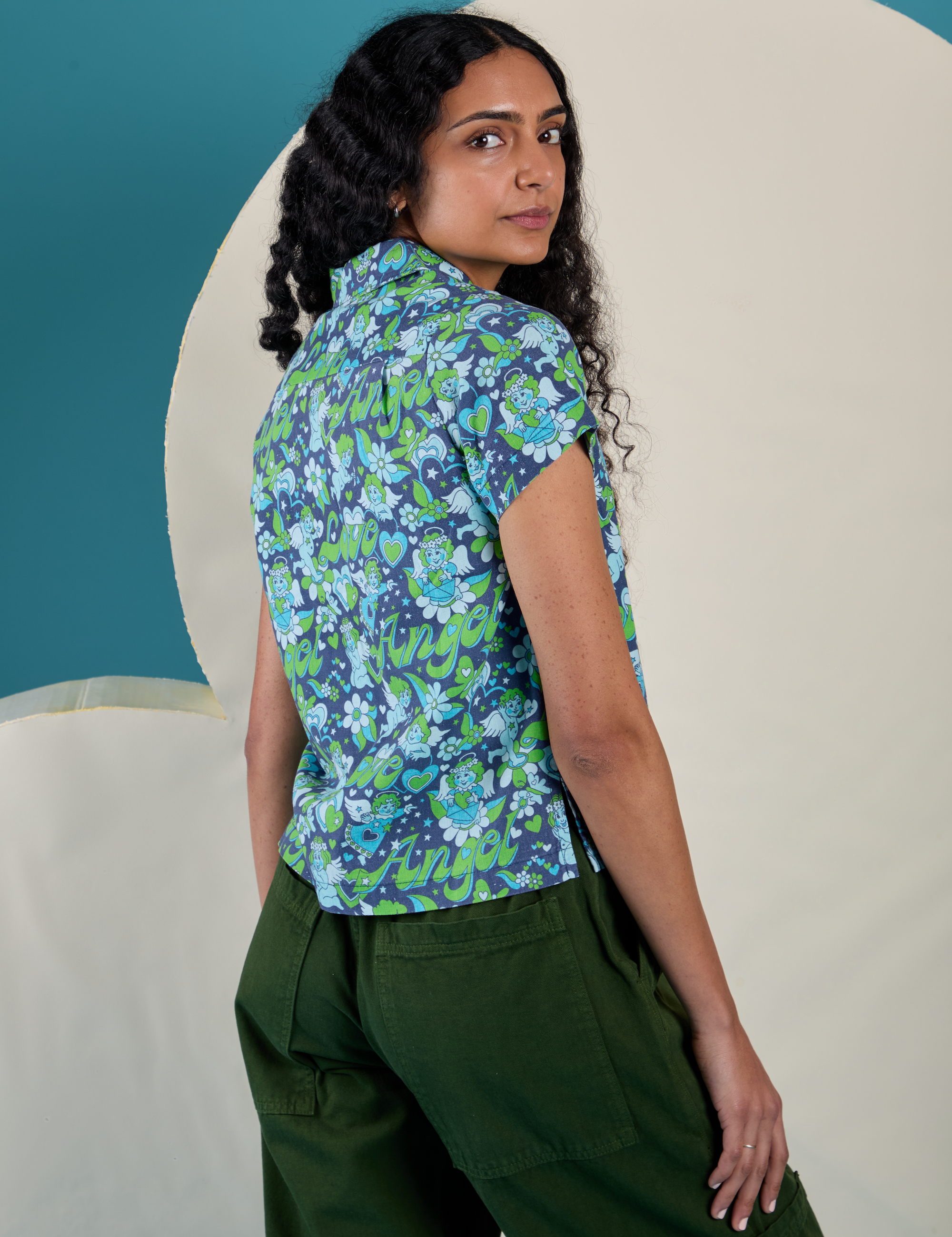 Angled back view of Angel Print Pantry Button-Up on Shahana