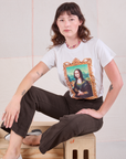 Alex is wearing Masters Organic Tee in Mona Lisa and espresso brown Western Pants