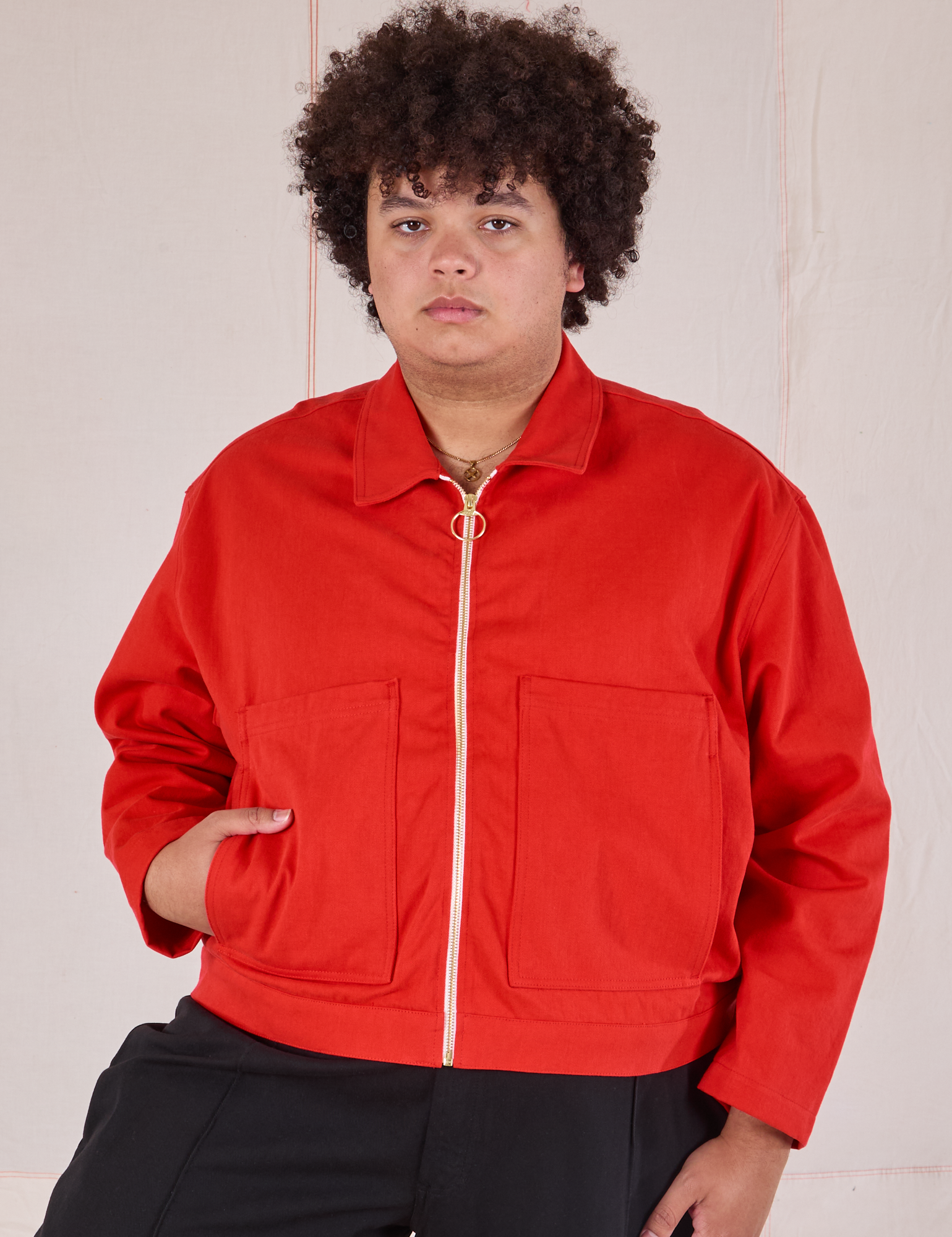 Miguel is 6’0” and wearing 1XL Mechanic Jacket in Mustang Red