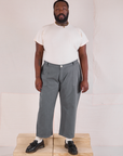 Elijah is 6'3" and wearing 1XL Mid-Rise Work Pants in Slate Grey paired with an Organic Vintage Tee in vintage tee off-white