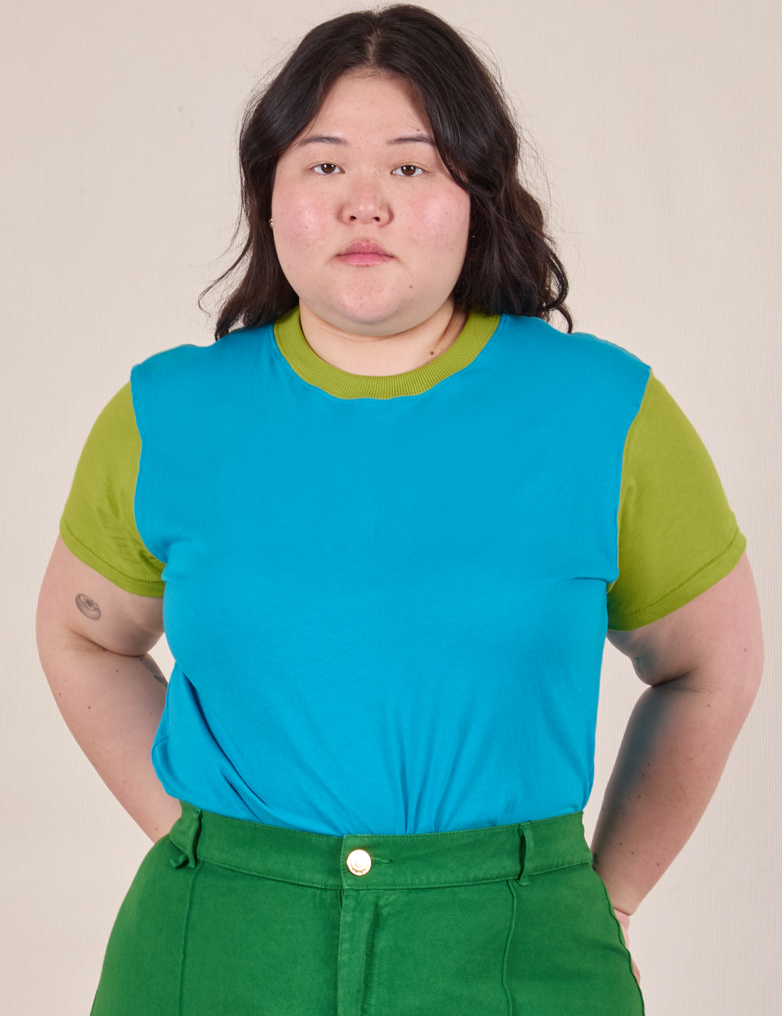 Ashley is 5’7” and wearing L Mismatched Tee in Blue &amp; Green