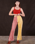 Alex is wearing Western Pants in Ketchup/Mustard Stripes and mustang red Cami
