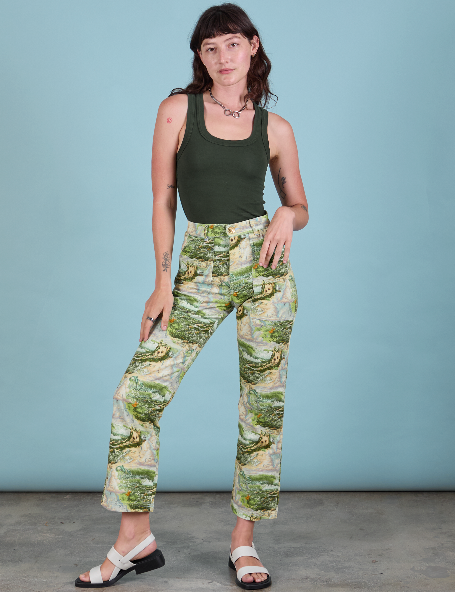 Alex is 5&#39;8&quot; and wearing XXS Work Pants in Ocean and Sky paired with a swamp green Tank Top