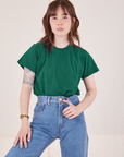 Hana is wearing Organic Vintage Tee in Hunter Green tucked into light wash Frontier Jeans