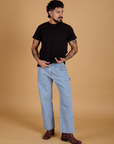 Jesse is wearing Organic Vintage Tee in Basic Black and light wash Carpenter Jeans