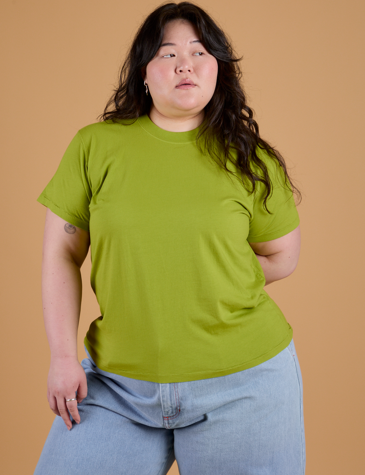 Ashley is 5’7” and wearing L Organic Vintage Tee in Gross Green