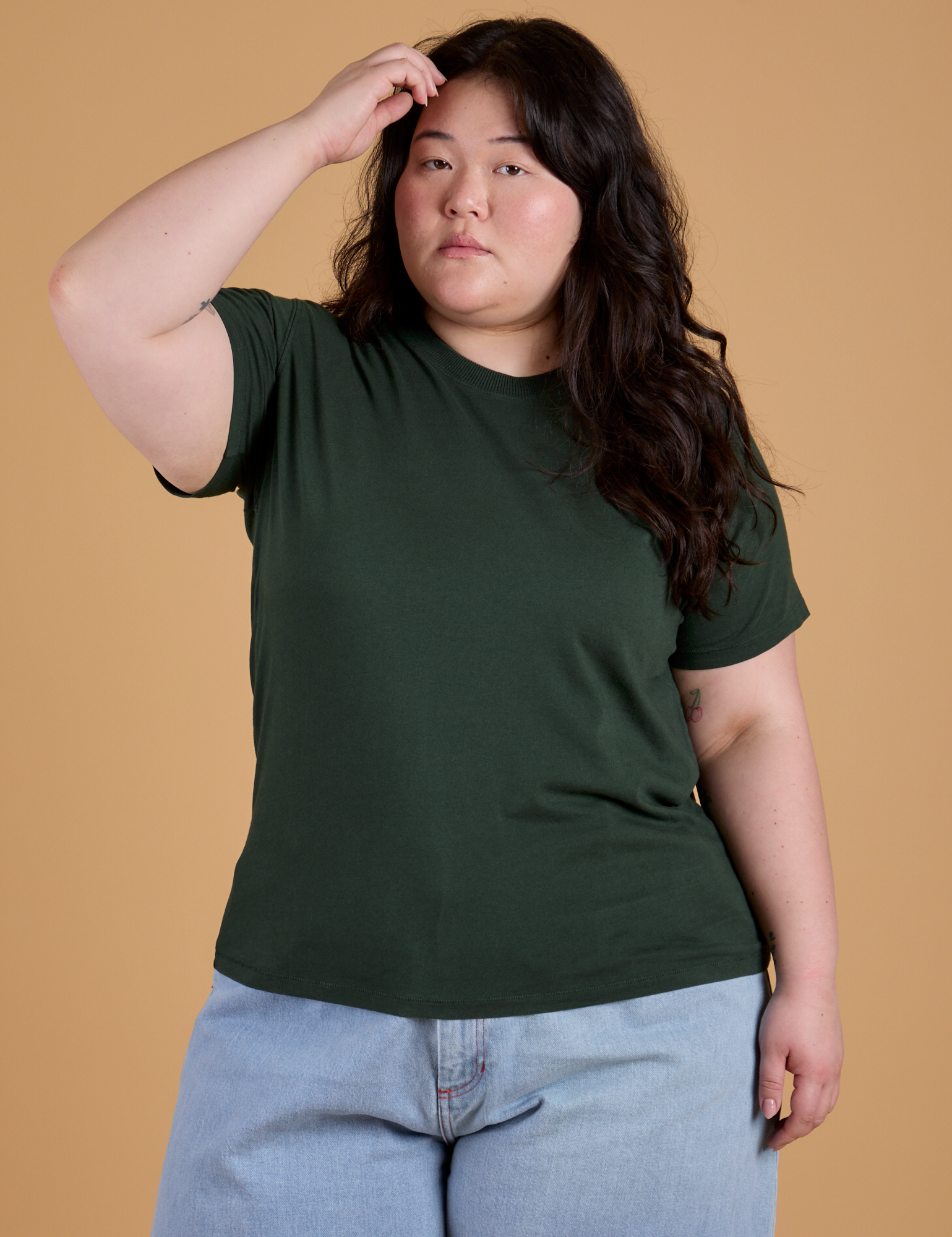 Ashley is 5’7” and wearing L Organic Vintage Tee in Swamp Green
