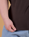 Bottom close up of Organic Vintage Tee in Espresso Brown with Ashley holding hem