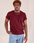 Issac is 5'10" and wearing S Organic Vintage Tee in Red Wine