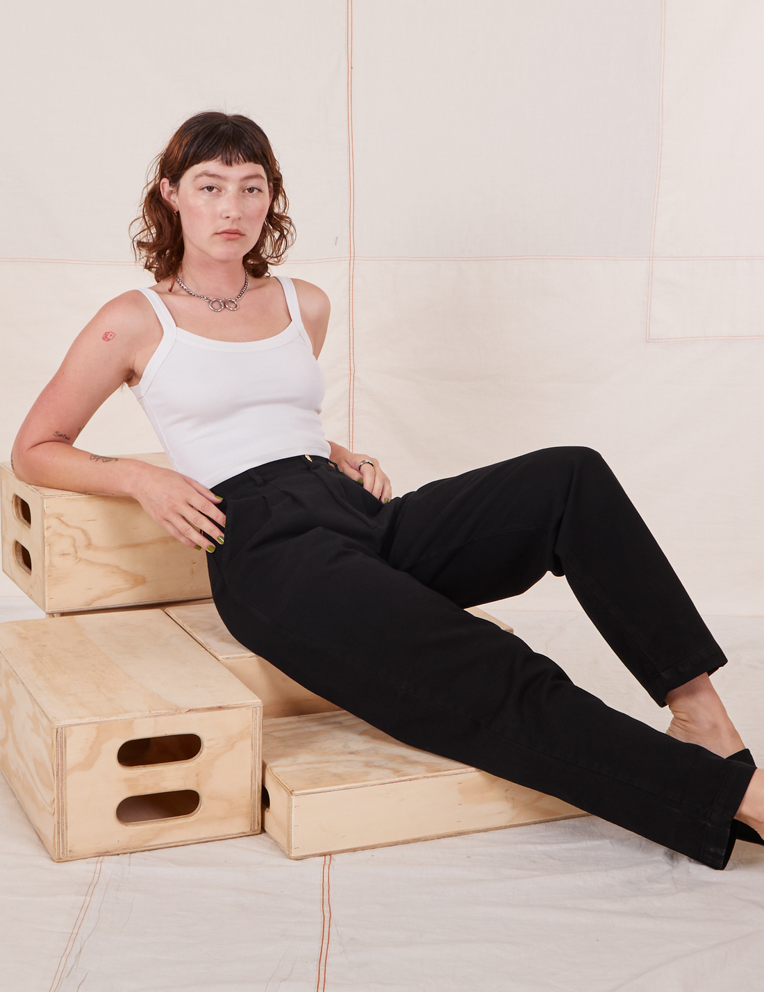 Alex is wearing Organic Trousers in Basic Black and vintage off-white Cropped Cami