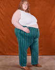 Side view of Overdye Stripe Work Pants in Blue/Green and vintage off-white Cropped Tank Top on Catie