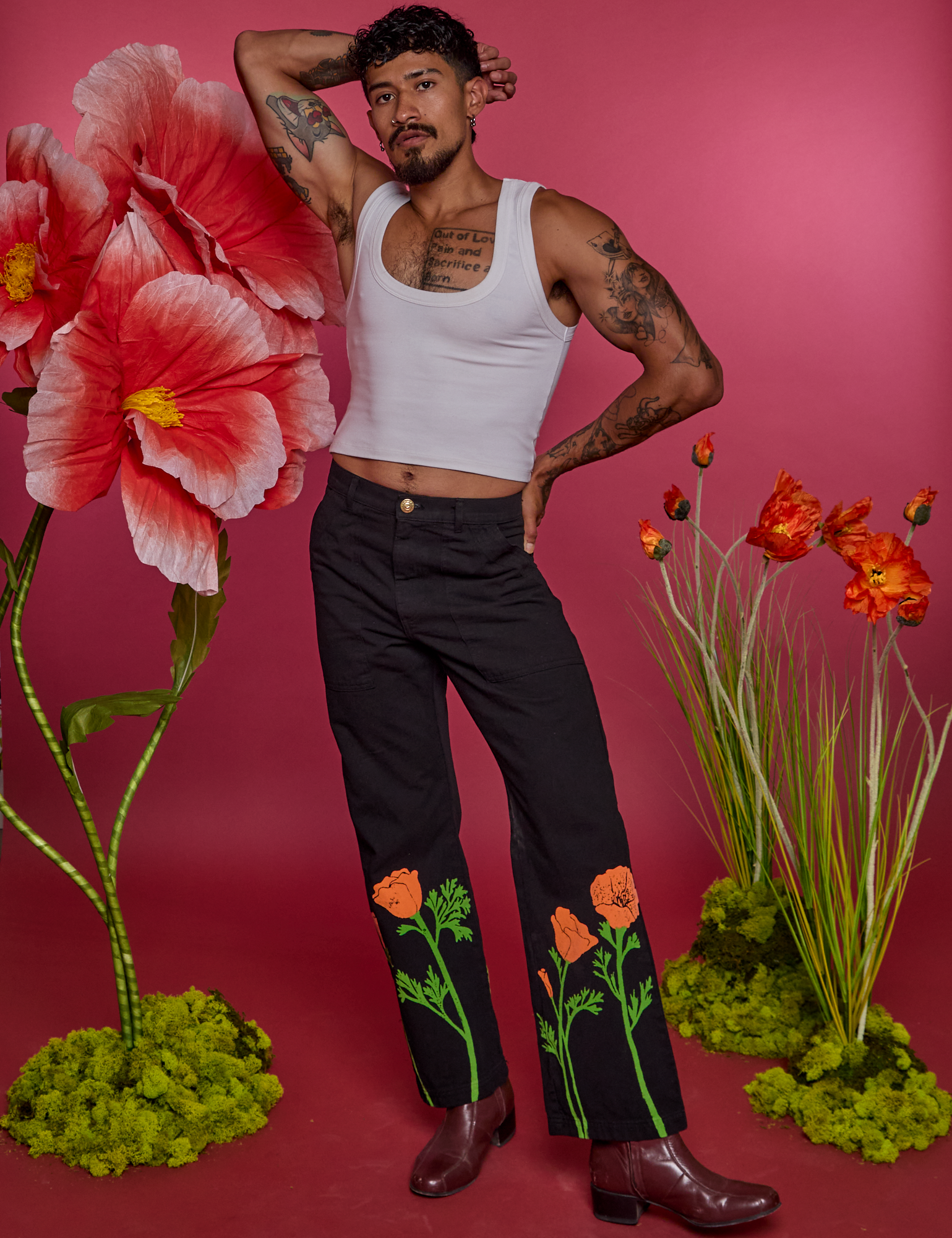 Jesse is 5&#39;8&quot; and wearing XS Paintstamped Work Pants in Poppy paired with a vintage tee white Cropped Tank