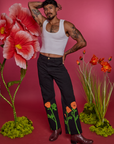 Jesse is 5'8" and wearing XS Paintstamped Work Pants in Poppy paired with a vintage tee white Cropped Tank