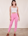 Alex is 5'8" and wearing XXS Pencil Pants in Bubblegum Pink paired with vintage off-white Cami