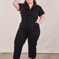 Ashley is 5’7” and wearing 1XL Petite Short Sleeve Jumpsuit in Basic Black.