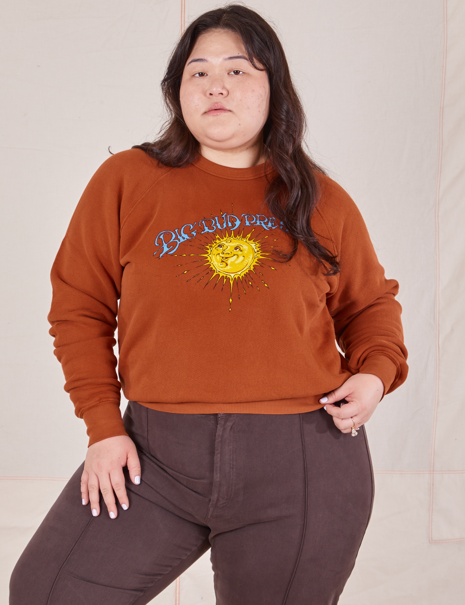 Ashley is 5&#39;7&quot; and wearing L Bill Ogden&#39;s Sun Baby Crew paired with espresso brown Western Pants