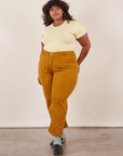 Work Pants in Spicy Mustard on Morgan wearing butter yellow Baby Tee