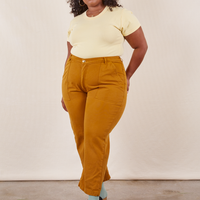 Work Pants in Spicy Mustard on Morgan wearing butter yellow Baby Tee
