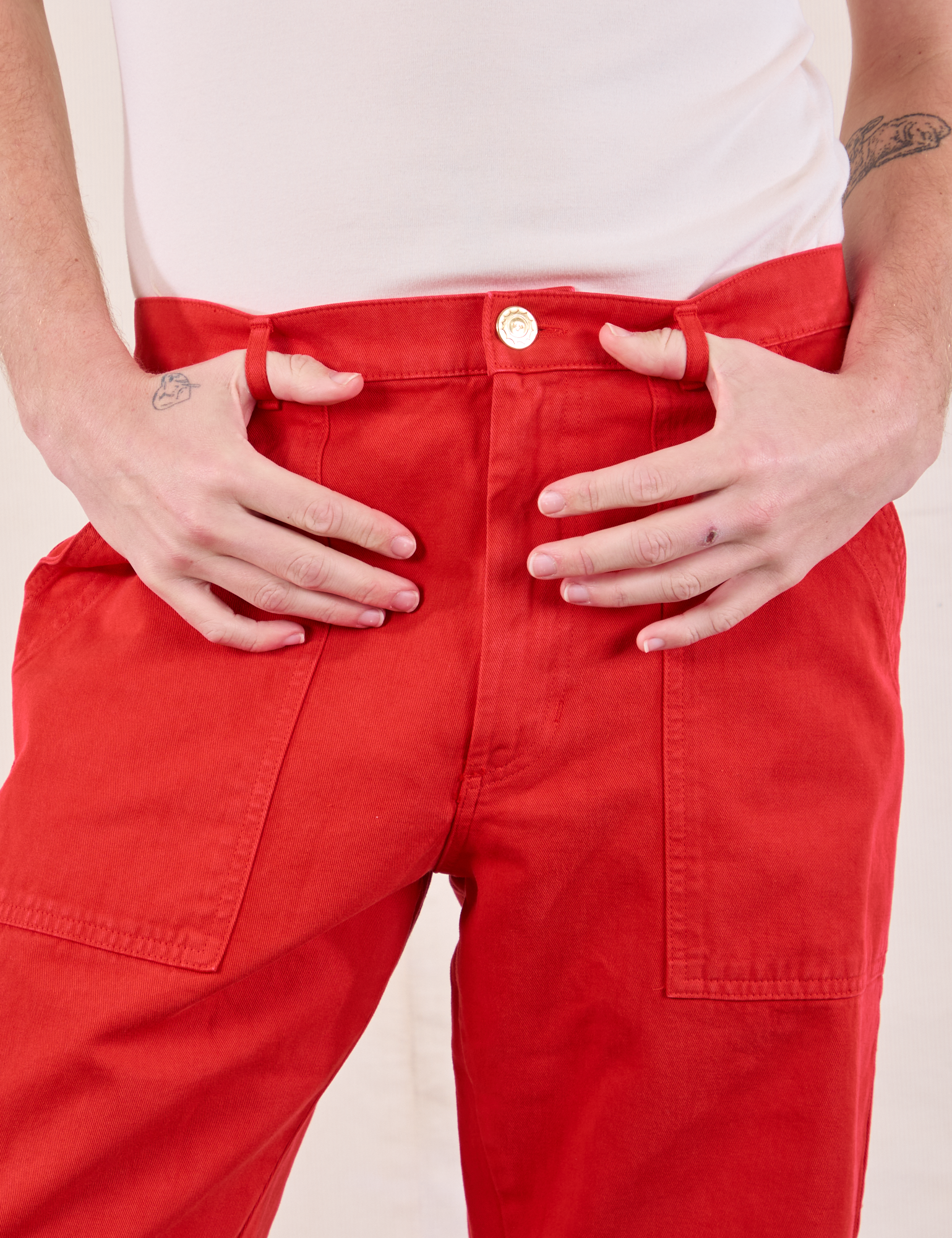 Work Pants in Mustang Red front close up on Quinn