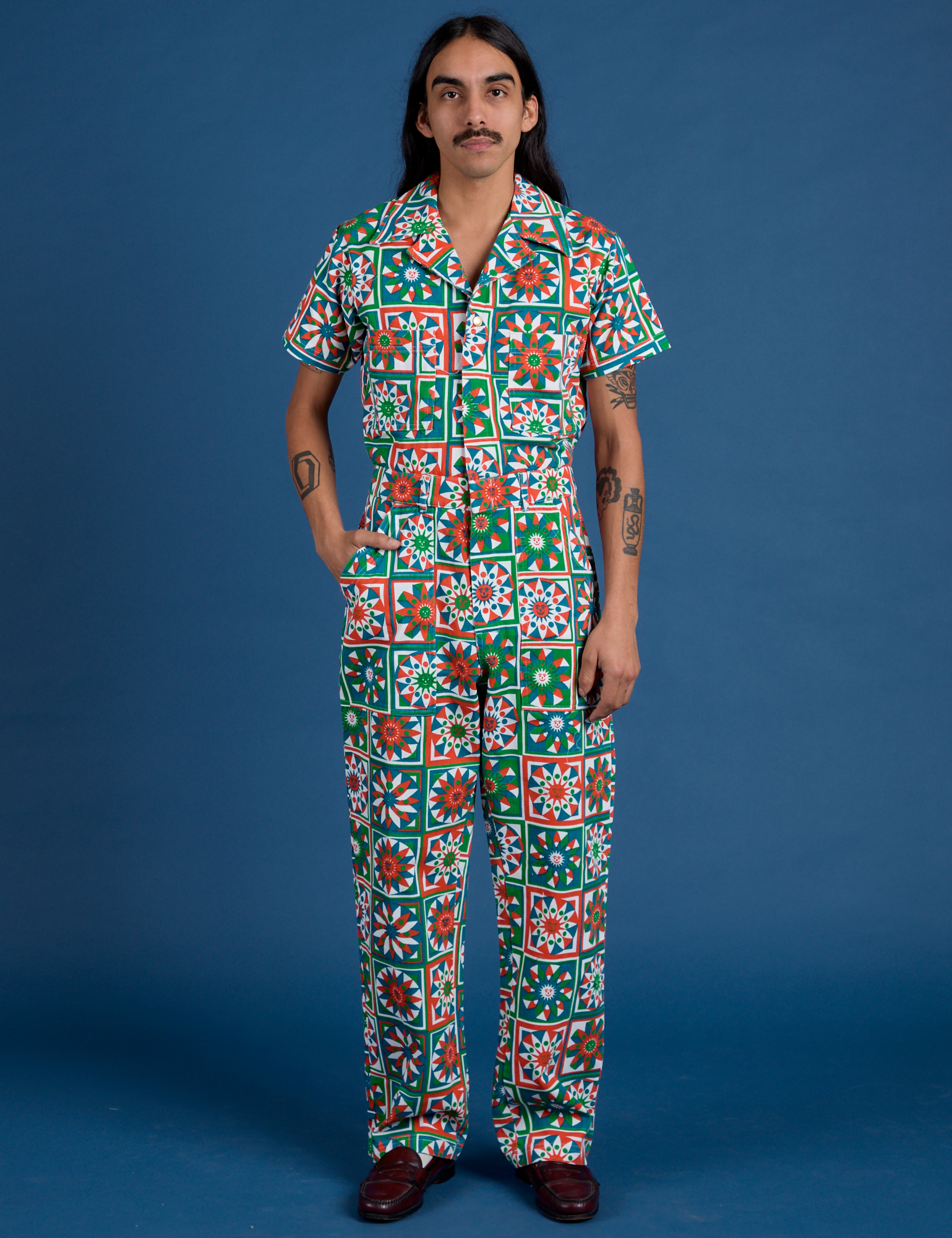 Anthony is 5’6” and wearing S Quilt Print Jumpsuit