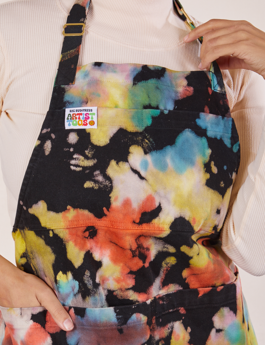 Front close up of Artist Togs Full Apron in Rainbow Magic Waters worn by Tiara