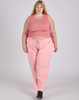 Juliet is wearing Drop Pocket Cargo Pants in Baby Pink and Muscle Tee