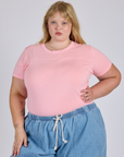 Juliet is 5’7” and wearing L Jr. Varsity Tee in Baby Pink