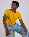 Jr. Varsity Tee in Sunshine Yellow and light wash Drop Pocket Pants worn by Isaac