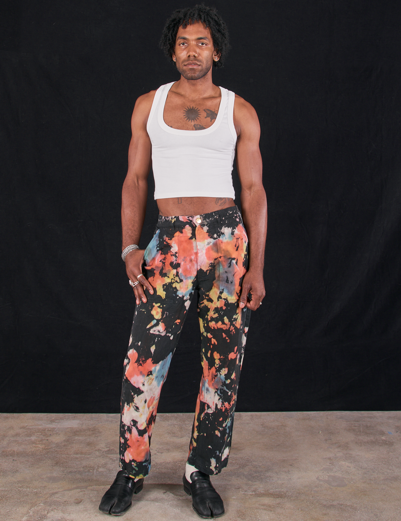 Jerrod is 6&#39;3&quot; and wearing M Rainbow Magic Waters Work Pants paired with a vintage tee off-white Cropped Tank