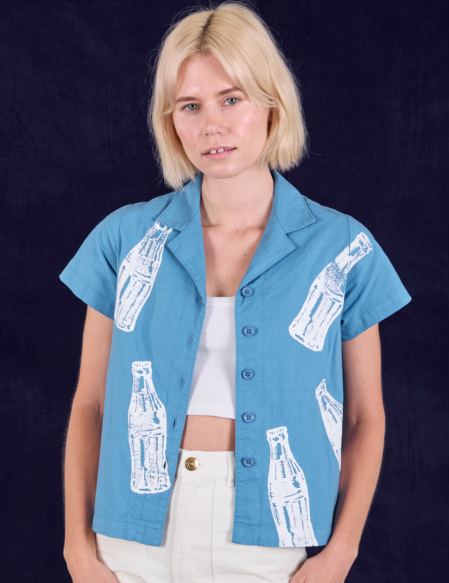 Madeline is 5&#39;9&quot; and wearing P Soda Bottle Pantry Button-Up in Greek Blue