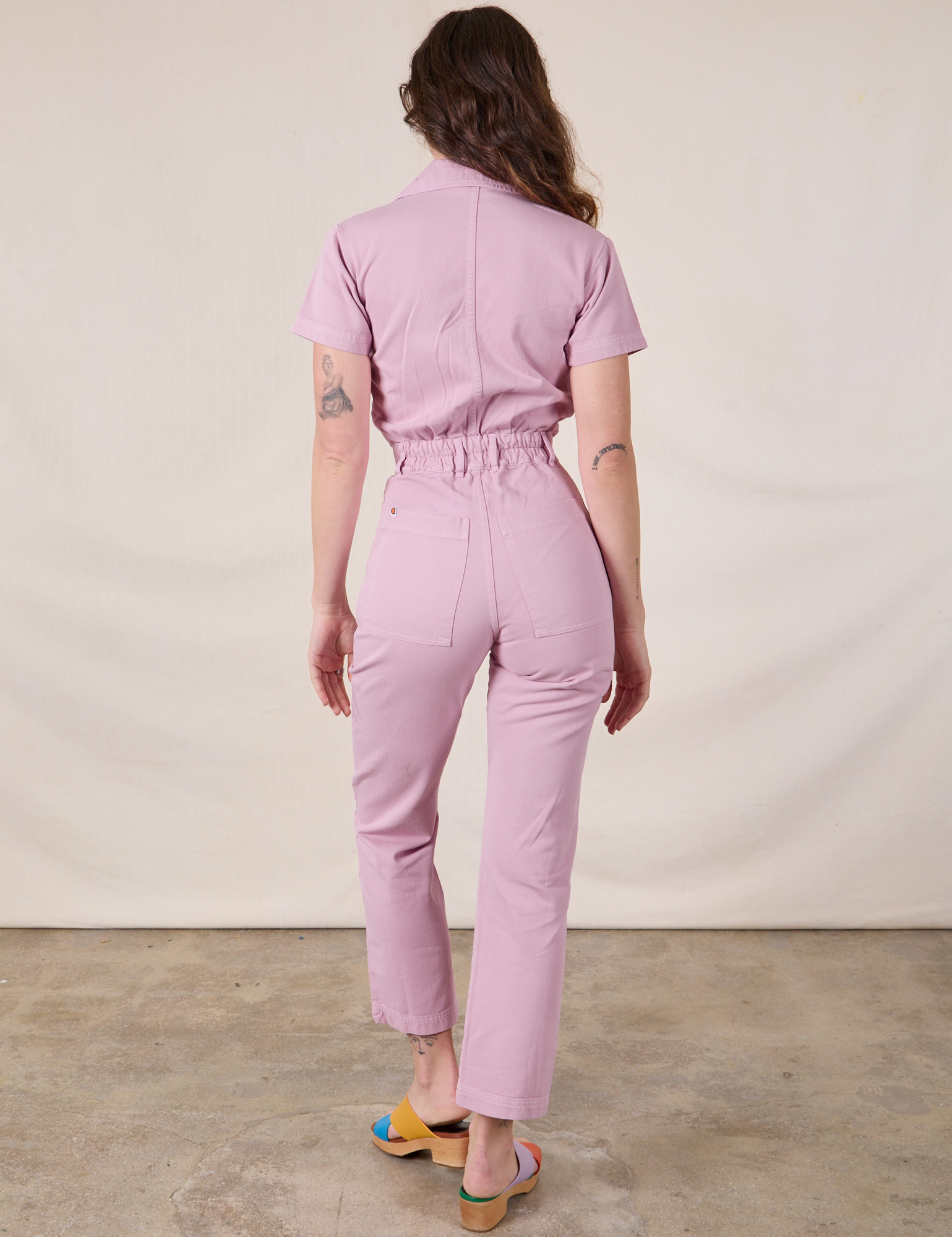 Short Sleeve Jumpsuit in Lilac back view on Alex