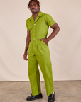 Short Sleeve Jumpsuit in Gross Green angled front view on Issac