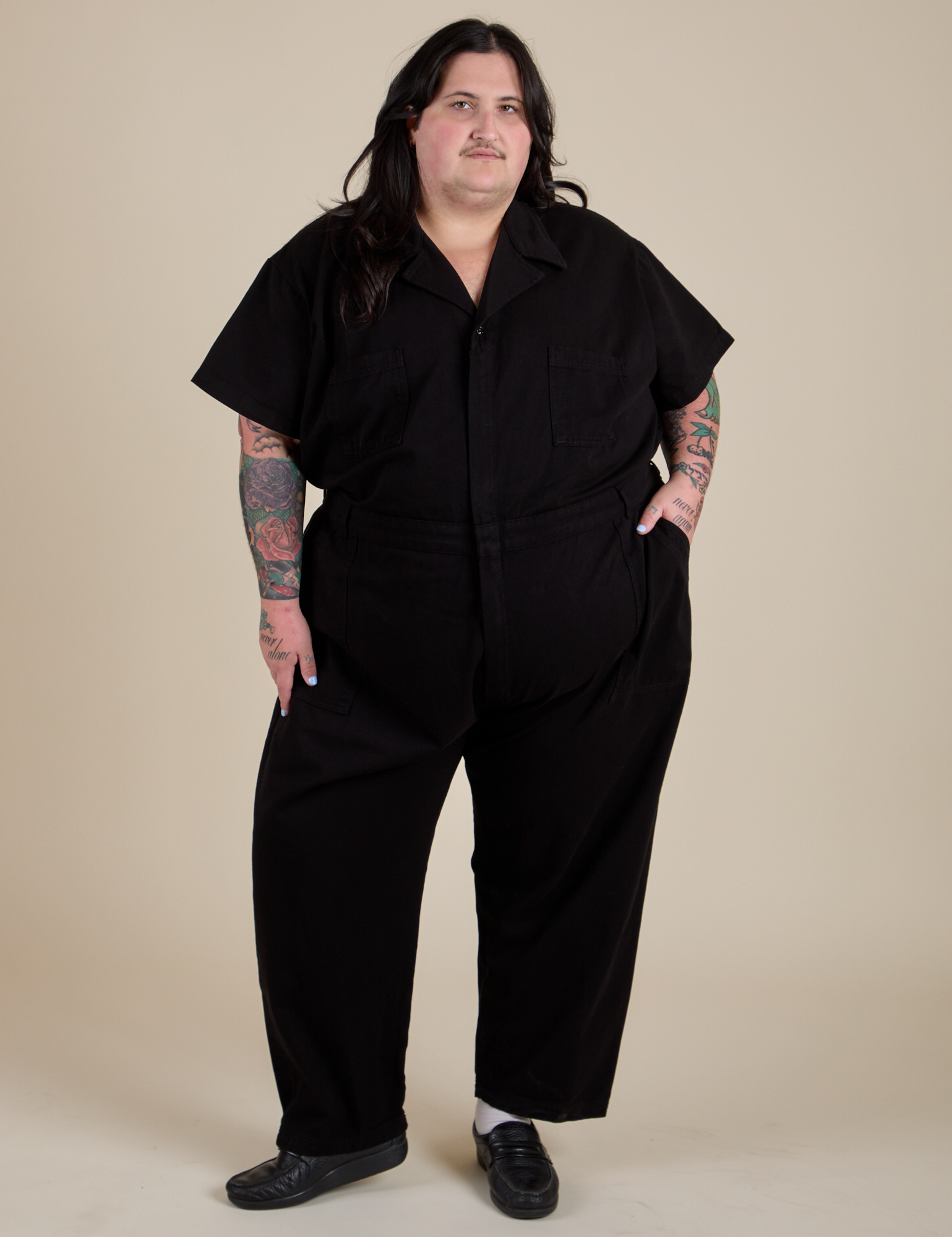 Sam is 5'10" and wearing 4XL Short Sleeve Jumpsuit in Basic Black