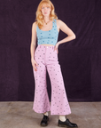 Margaret is wearing Star Bell Bottoms in Lilac Purple paired with Star Cropped Tank in blue