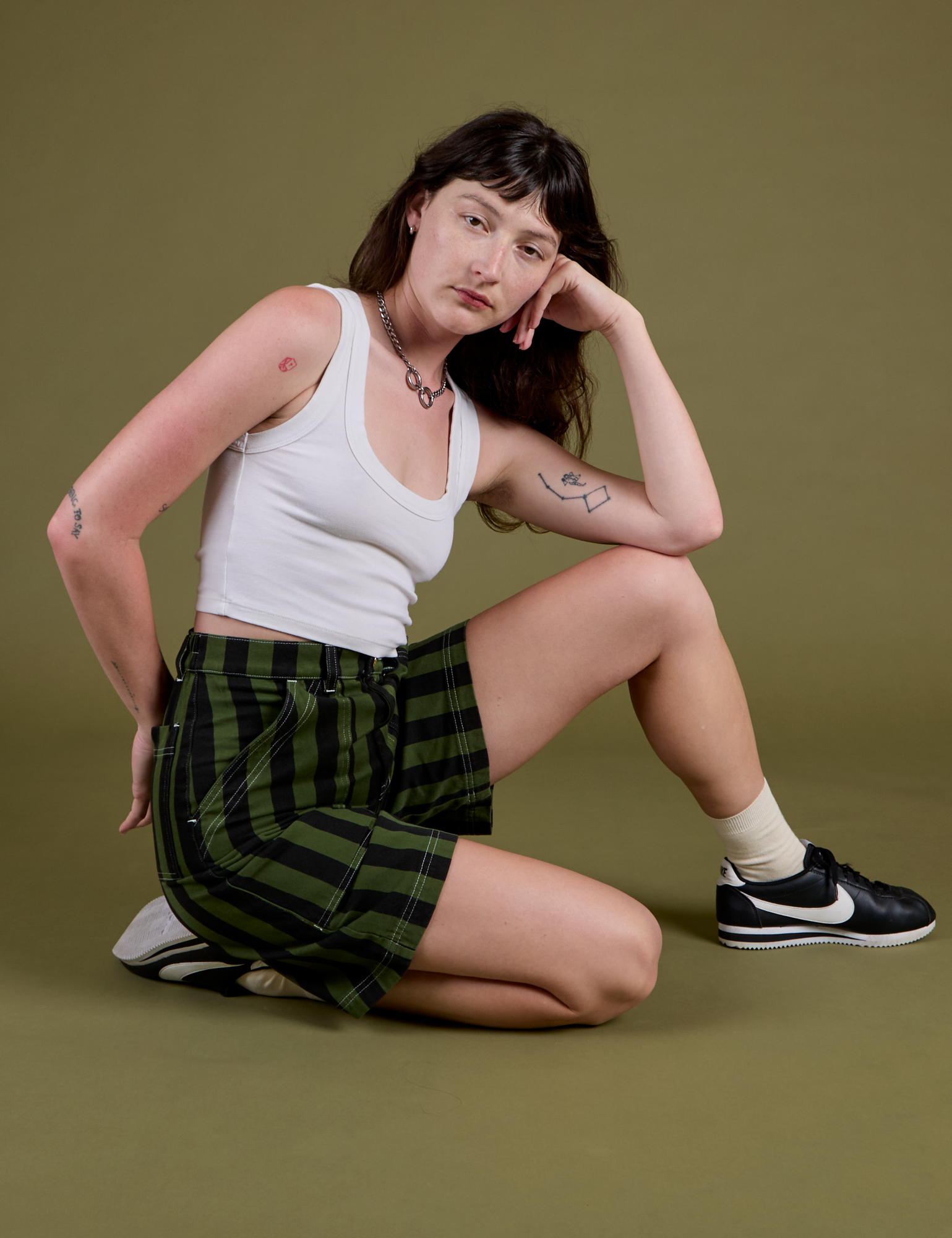 Longline Work Shorts in Evergreen and vintage tee white Cropped Tank on Alex