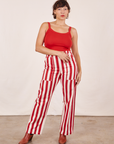 Tiara is 5'4" and wearing S Work Pants in Cherry Stripe paired with mustang red Cropped Cami