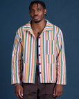 Isaac is 5’10” and wearing M Stripe Work Jacket in Rainbow Stripe