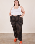 Marielena is 5'8" and wearing 2XL Black Striped Work Pants in Espresso paired with vintage off-white Cropped Tank Top