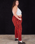 Black Stripe Work Pants in Mustang Red side view on Katie