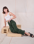 Carpenter Jeans in Swamp Green and Cropped Tank in Vintage Tee Off-White worn by Alex