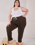 Marielena is wearing Rolled Cuff Sweat Pants in Espresso Brown and vintage off-white Cropped Tank