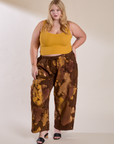 Juliet is 5'7" and wearing 1XL Magic Waters Drop Pocket Pants in Honey Brown paired with mustard yellow Cropped Tank