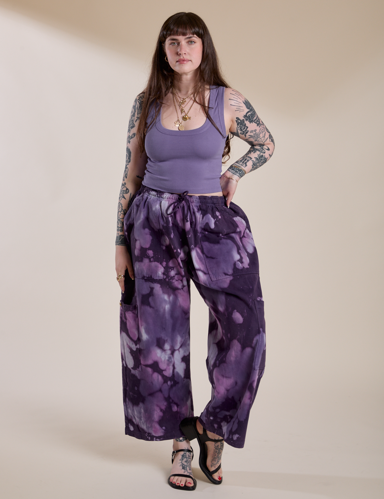 Sydney is 5'9" and wearing L for an oversized look Magic Waters Drop Pocket Pants in Dark Lavender paired with faded grape Cropped Tank