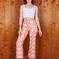 Alex is 5'8" and wearing XS Western Pants in Pink Jacquard