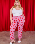 Juliet is 5'7" and wearing 1XL Paintstamped Heart Work Pants in Bubblegum Pink