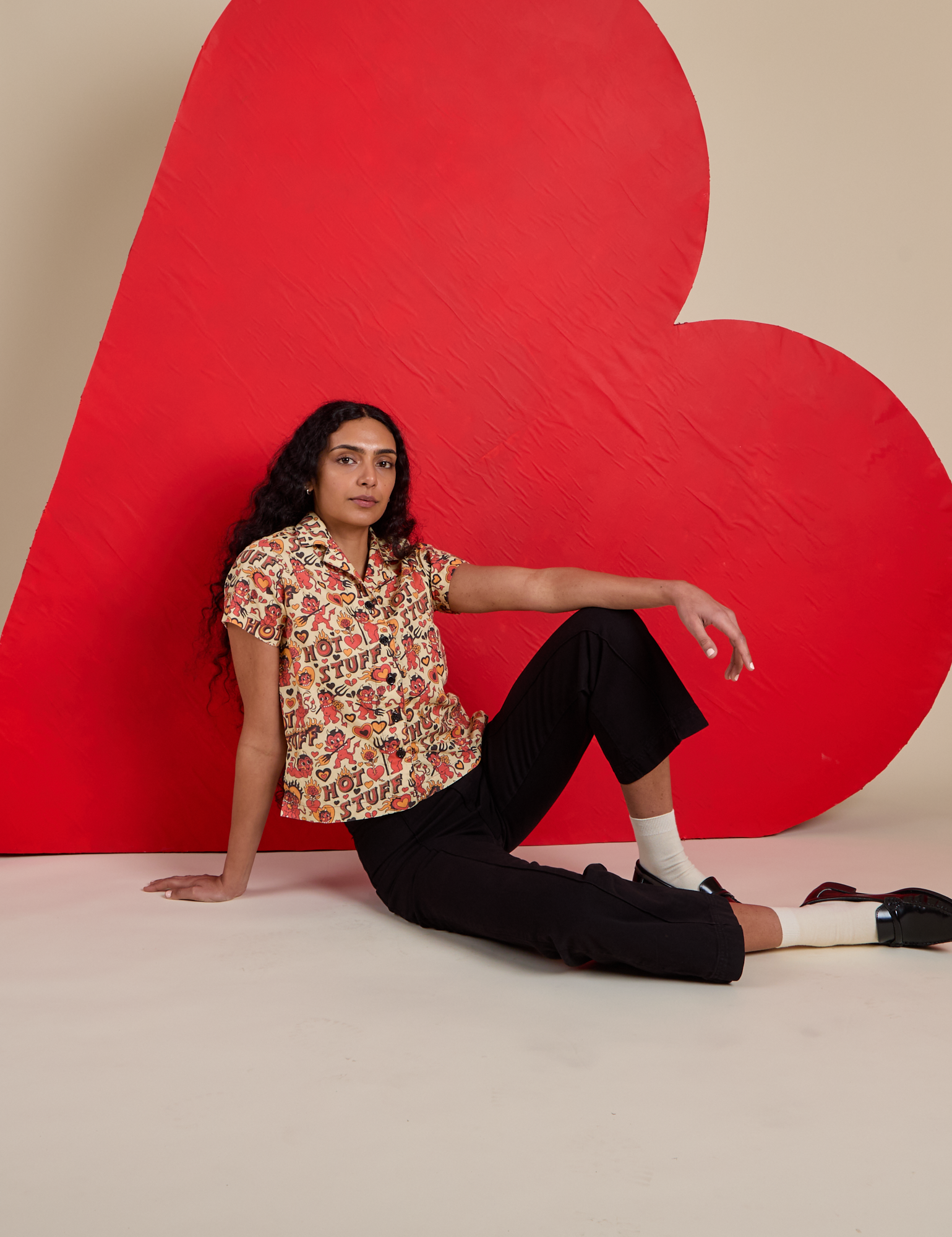 Hot Stuff Print Pantry Button-Up and black Work Pants worn by Shahana