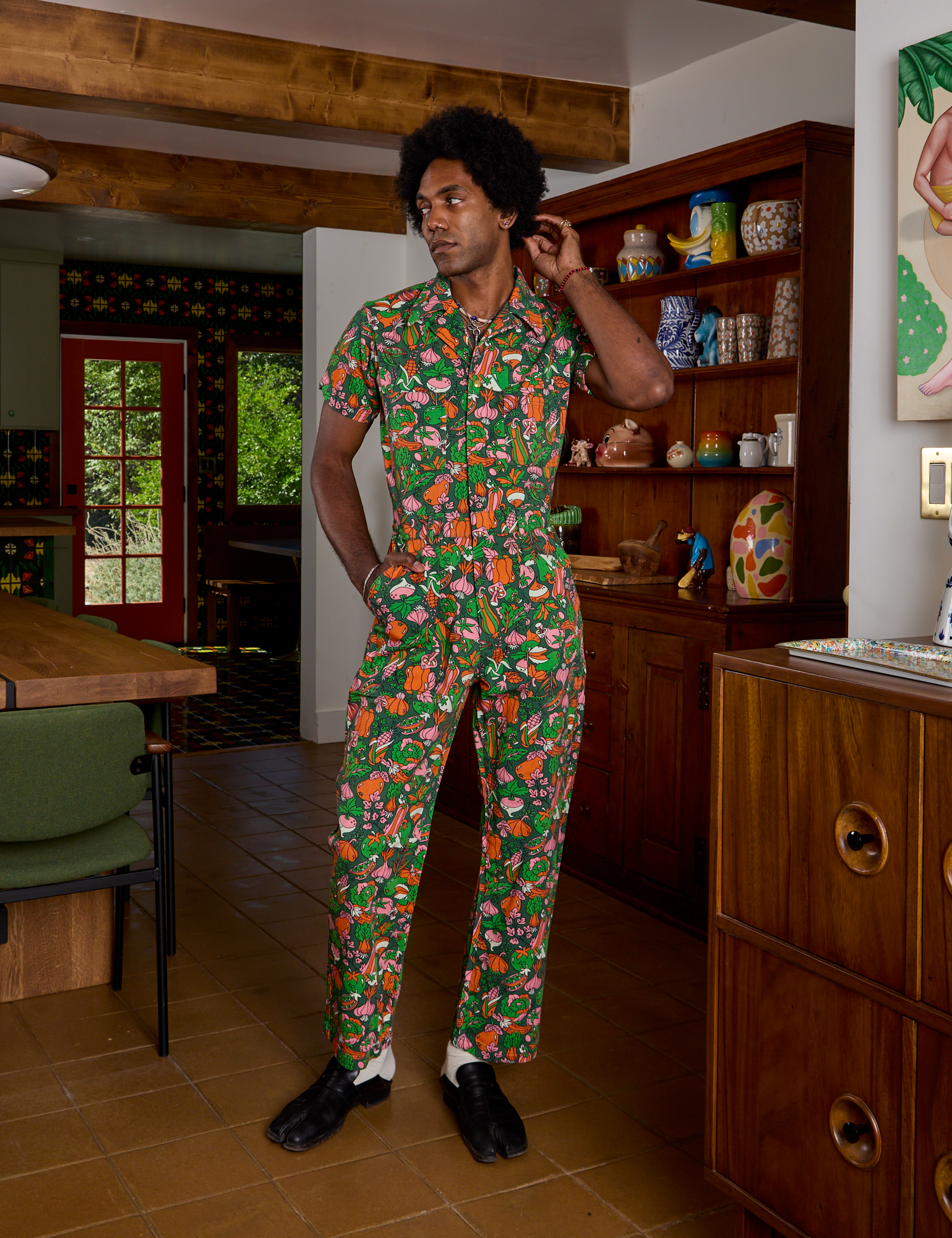 Jerrod is wearing Short Sleeve Jumpsuit in Kitchen Collection