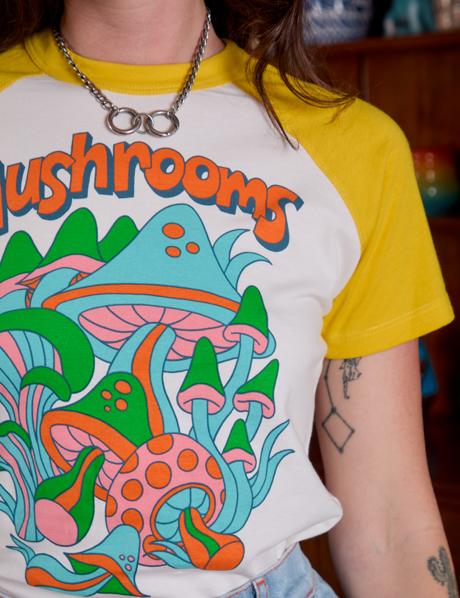 Short Sleeve Raglan Tee in Mushrooms front close up on Alex